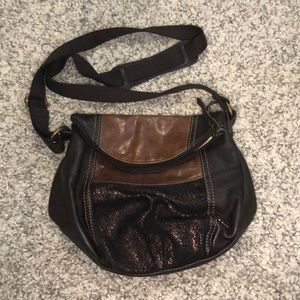 The Sak brand crossbody purse